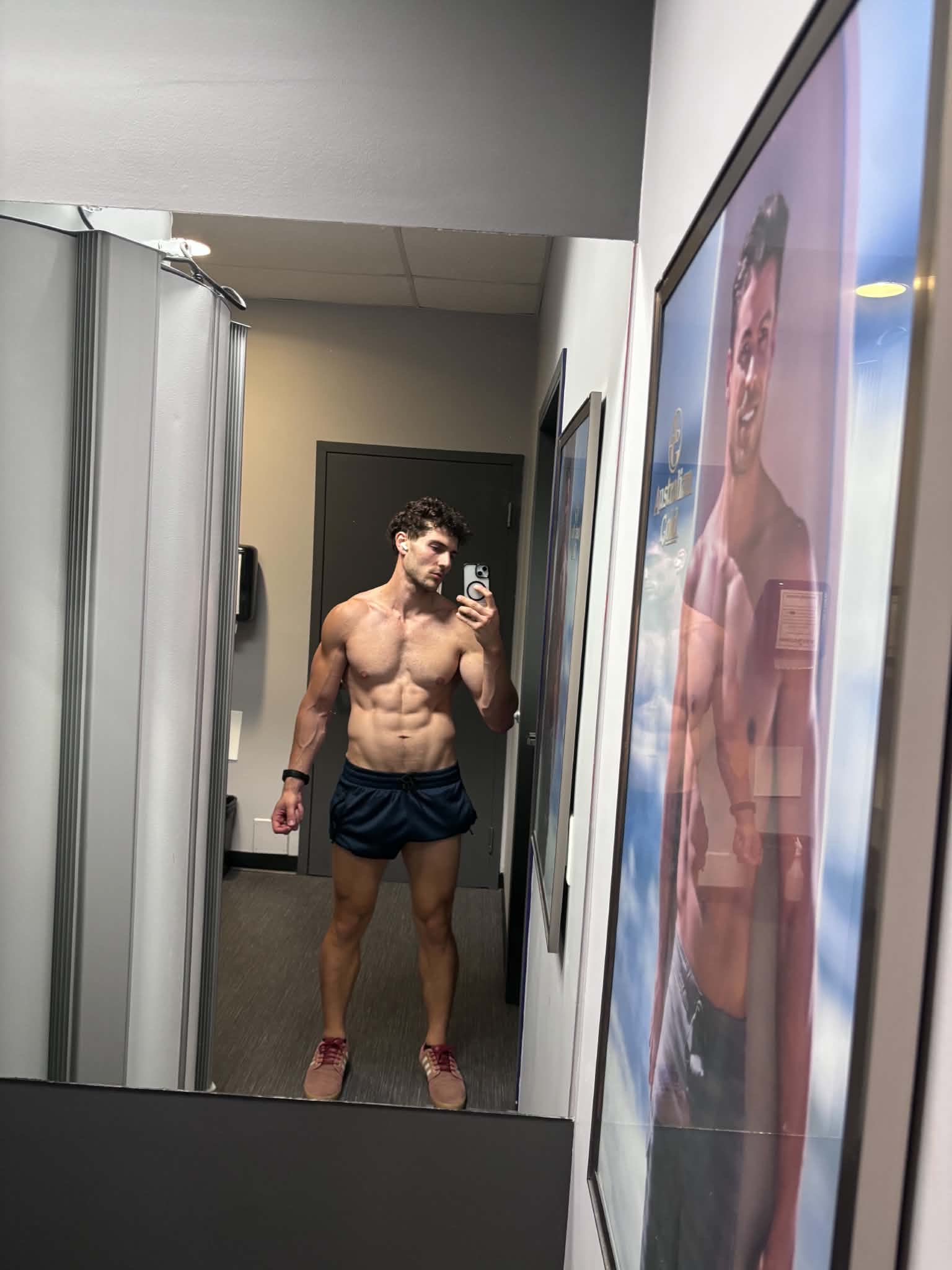 Male client showing improved muscle definition after coaching
